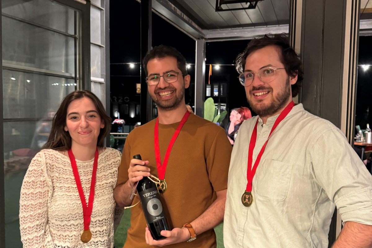 The winning team of the Barkeet Quiz with their medals and a bottle of wine